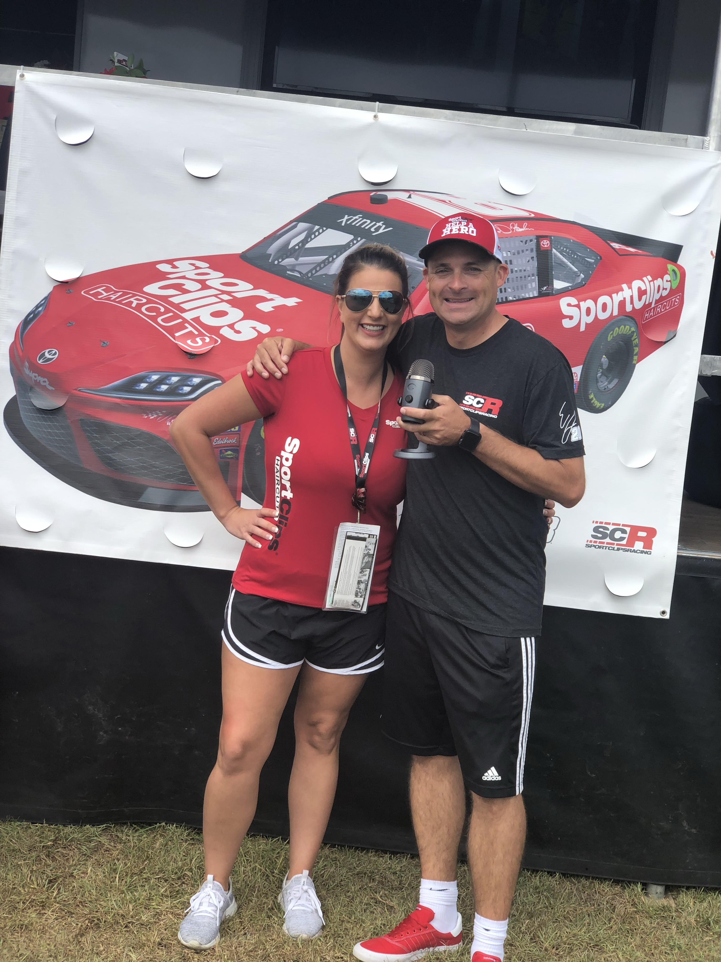 Chad Jordan and Crystal Smith holding a microphone